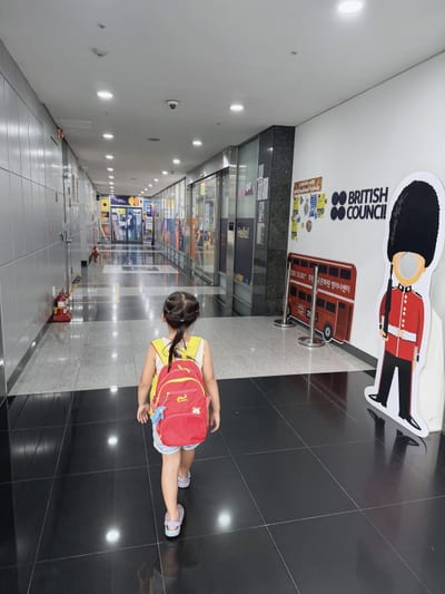 My daughter walking down the corridor into the British Council