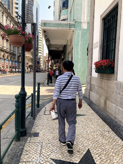 My father walking ahead of me on the mosaic pavement of old Macau