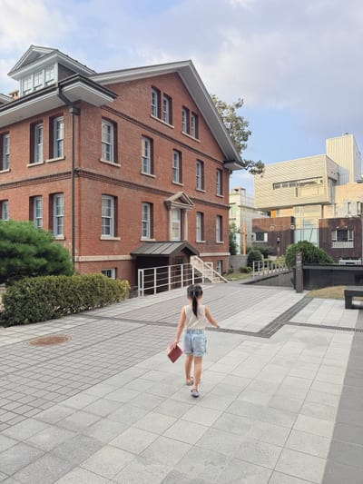 My daughter crossing the courtyard of the old school