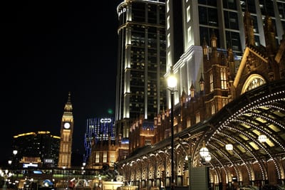 Cotai at night, a lit arcade running beside the clock tower
