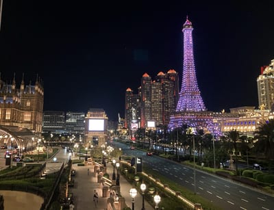 The Cotai strip at night, the Parisian tower lit above the boulevard