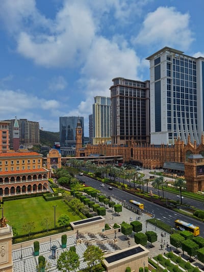 Cotai under a bright sky, hotels lining the boulevard