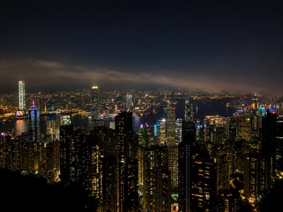 Hong Kong at night from Victoria Peak, the harbour cutting across the city