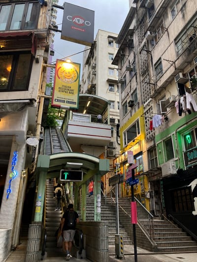 The Mid-Levels escalator running up between old buildings in SoHo